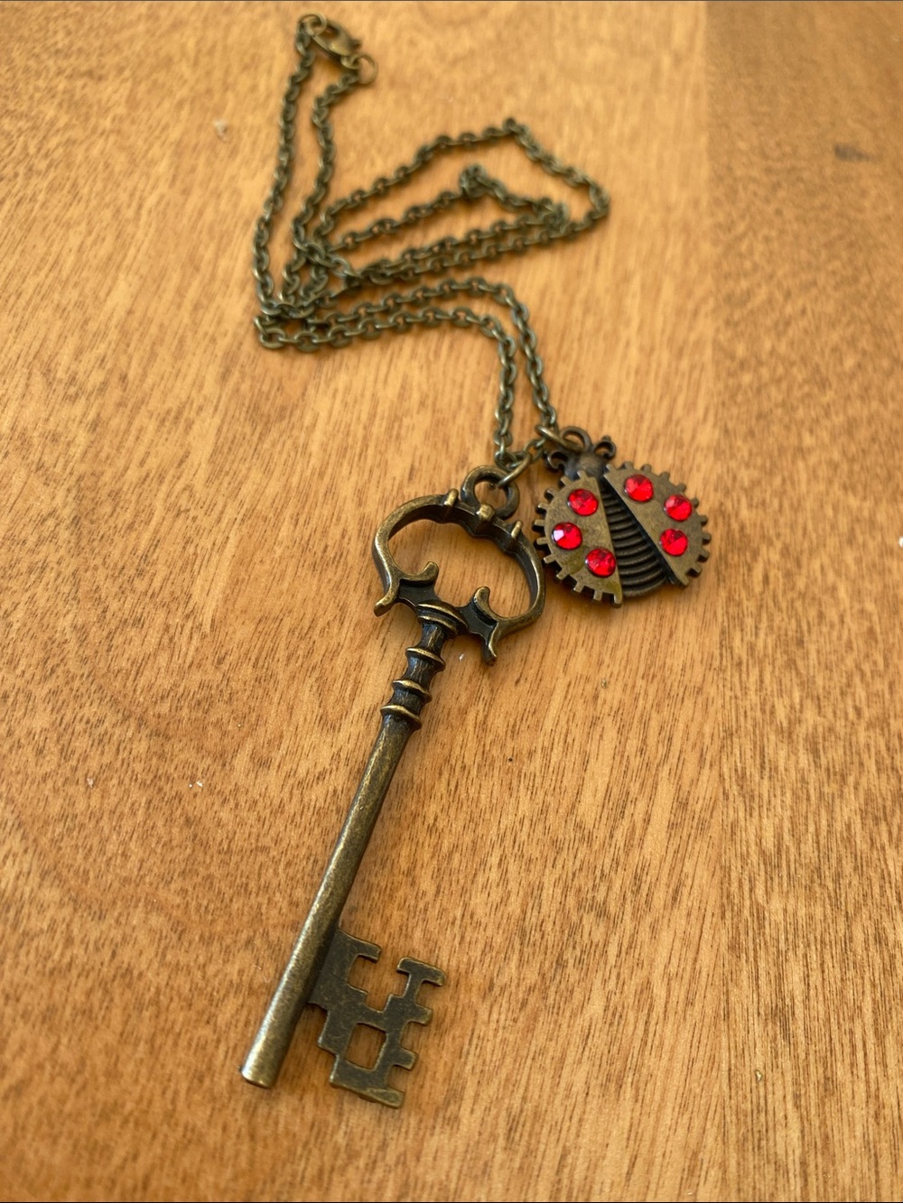 Antique Brass Key Necklace with Red Ladybug Charm